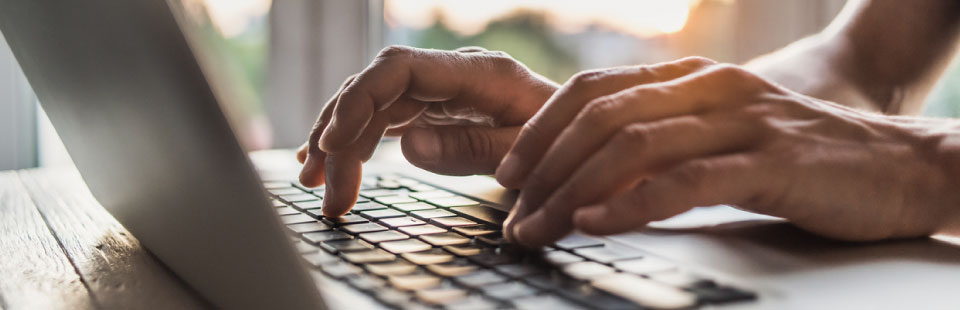 man using laptop computer in the office