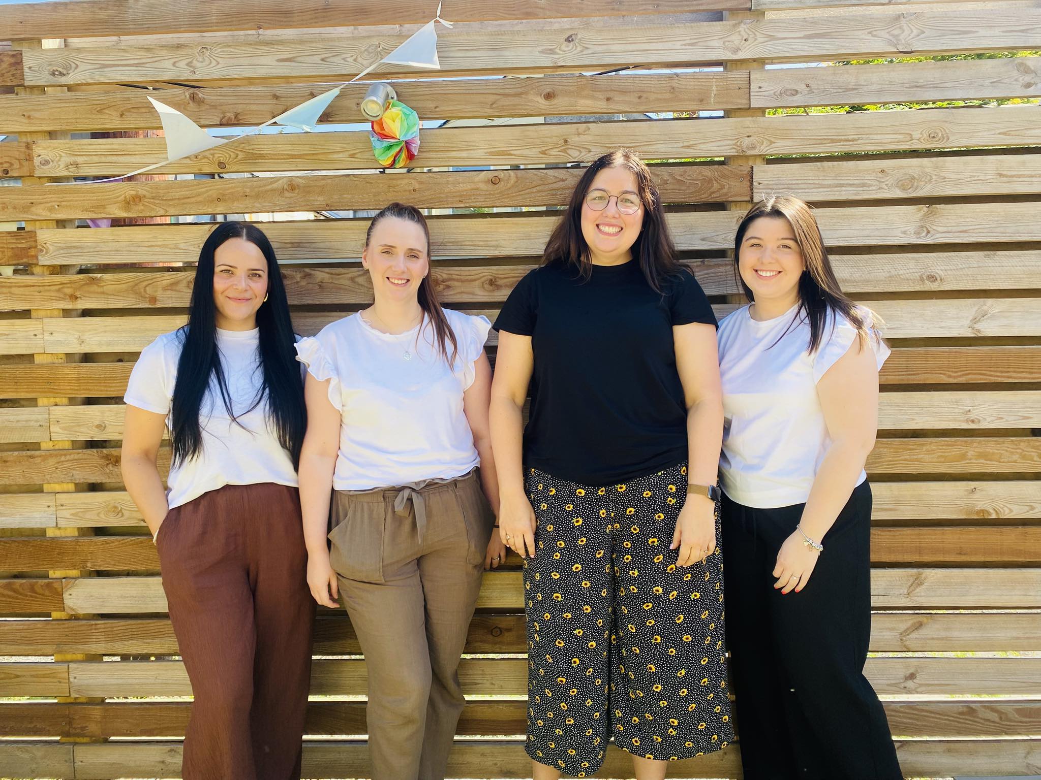 Four women from Cadoc House smiling