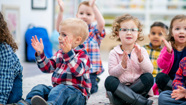 nursery children sitting and singing 